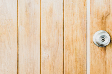 Classic wooden background door with door knob and copy space