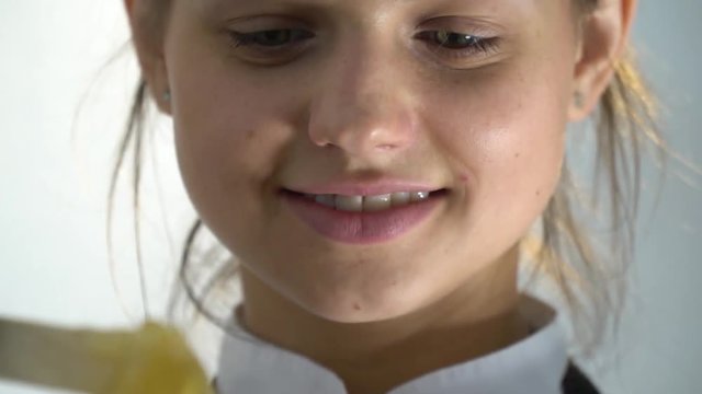 The brunette smiles and takes out of the jar a sugar mass for a shugaring, refocus. Slow motion