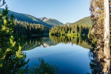 Naklejka na ściany i meble Mountain lake in mountains at sunny day British Columbia Canada.