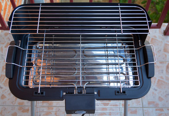 An empty electric grill stove for your barbecue or stake, ready to cook meat