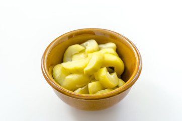 mango compote in brown bowl on white background