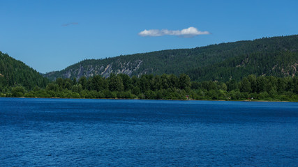 Mountain lake in mountains at sunny day British Columbia Canada.