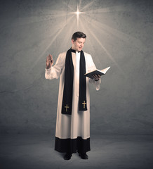 young priest in giving his blessing