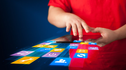 Obraz premium Hand holding tablet device with media application