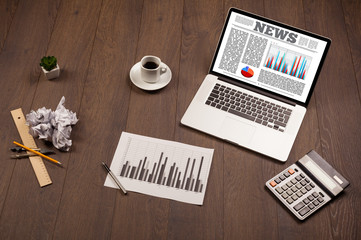 Computer laptop on desk with office accessories