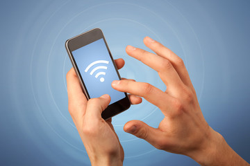 Female hand holding smartphone