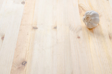 Garlic on wooden table background
