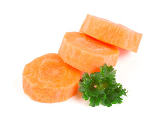 Chopped carrot slices and parsley herb leaves isolated on white background