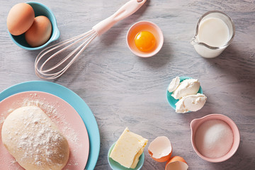 Baking ingredients flat lay on wooden background with copy space. Top view