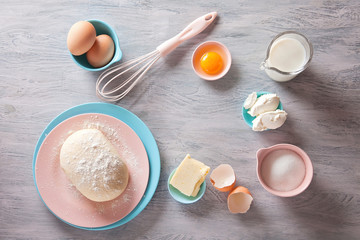 Baking ingredients flat lay on wooden background with copy space. Top view