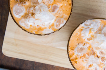 thai tea milkshake beverage thailand style and dessert on wood table