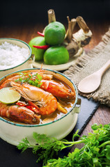 Thai food, River prawn spicy soup or tom yum goong on wooden table