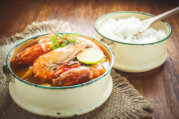 Thai food, River prawn spicy soup or tom yum goong on wooden table