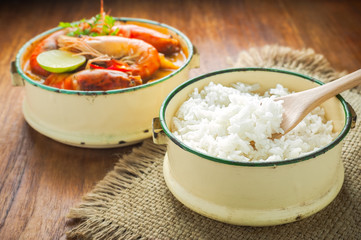 Thai food, River prawn spicy soup or tom yum goong on wooden table
