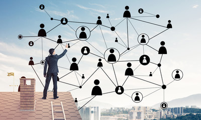 Businessman on house roof presenting networking and connection c