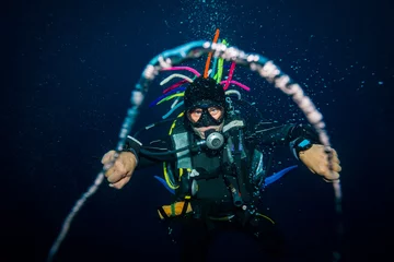 Fotobehang The diver lets the rings © sergemi