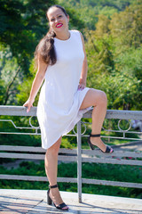 Mature European Or American Woman With Long Dark Hair And Fuchsia Lips Rest In City Park Mature European Or American Woman With Long Dark Hair And Fuchsia Lips Rest In City Park