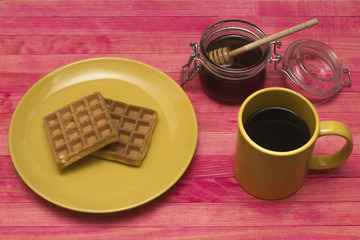 Fototapeta na wymiar Viennese waffles with mug coffee and honey