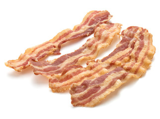 cooked crispy slices of bacon isolated on white background