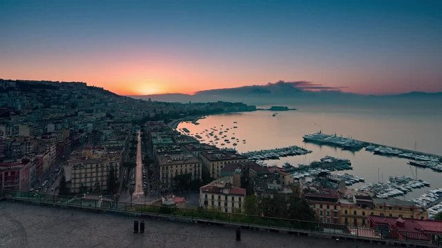 naples cityscape skyline time lapse from night to day sun rising over city