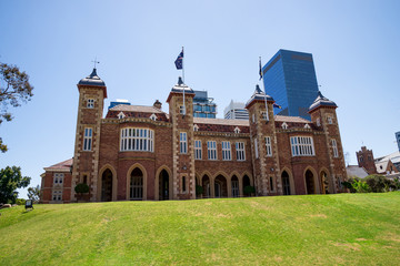 Fototapeta na wymiar A view of Government House with Perth Central Business district buildings on background