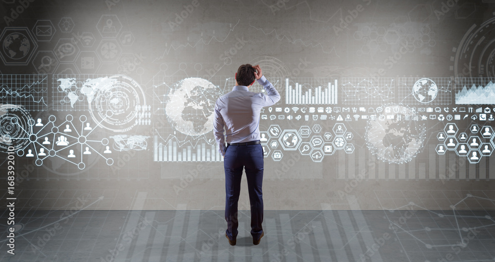 Poster Businessman using graph screens interface on a wall 3D rendering