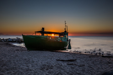 Fototapeta premium Amazing sunrise on the pier at the seaside. Gdynia Orlowo, Poland