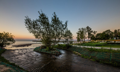 Fototapeta premium Amazing sunrise on the pier at the seaside. Gdynia Orlowo, Poland