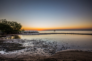 Fototapeta premium Amazing sunrise on the pier at the seaside. Gdynia Orlowo, Poland