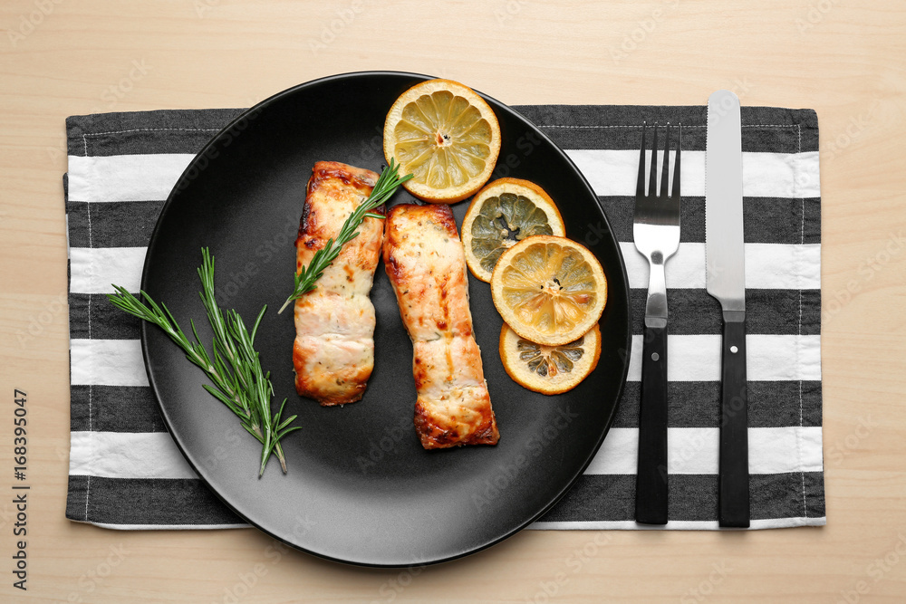 Sticker Plate with slices of lemon and salmon on light table