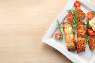 Delicious roasted salmon fillets with vegetable on plate