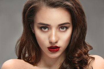 Portrait of beautiful woman with red lips