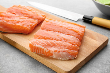 Fresh salmon fillet on wooden board