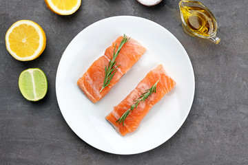 Fresh salmon fillet with rosemary on plate