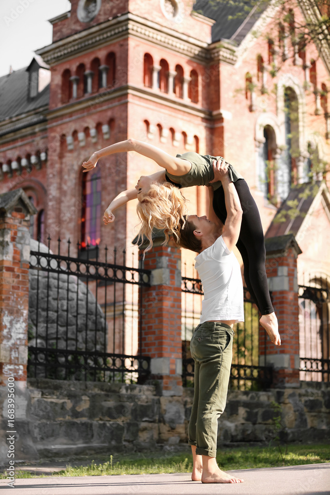 Wall mural Passionate couple dancing outdoors