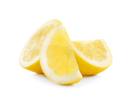Delicious sliced lemons on white background
