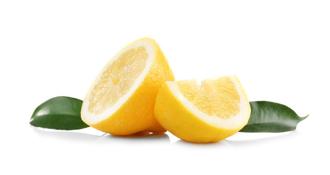 Delicious sliced lemons and leaves on white background