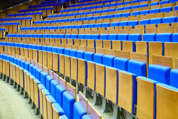 Naklejka premium Empty blue seats in the rows