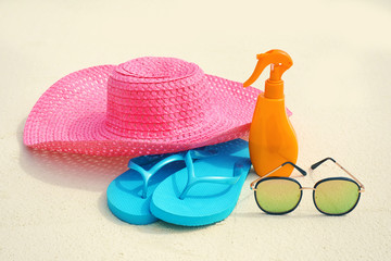 Beach accessories on sand at sea resort. Summer vacation concept