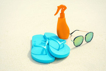 Beach accessories on sand at sea resort. Summer vacation concept