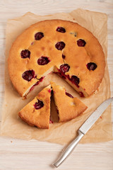 Home plum pie on baking paper.