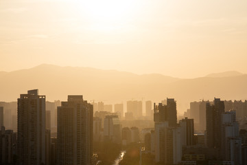 Fototapeta na wymiar City during warm sunset