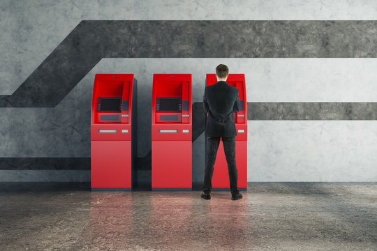 Man Using Red ATM Machine