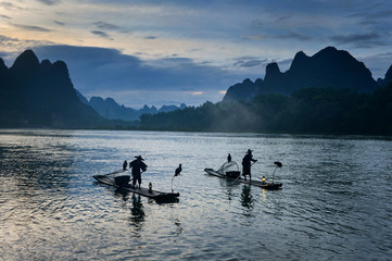 Fisherman of Guilin, Li River and Karst mountains during the blue hour of dawn,Guangxi  China