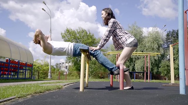 training young couples on the Playground outside. doubles sport