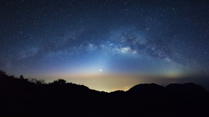 Starry night sky with high moutain at Doi Luang Chiang Dao and milky way galaxy with stars and space dust in the universe
