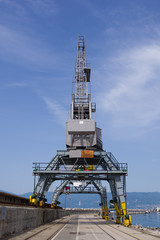 Close up view of one crane on the tracks in the port of Rijeka. Croatia.