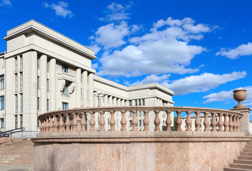 City landscape with blue sky and clouds. Classic facade with balcony at Minsk, Belarus.