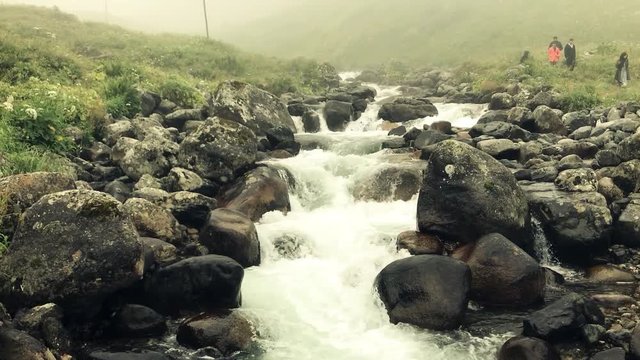 Fast moving river and wooden bridge in elevit plateau from rize turkey