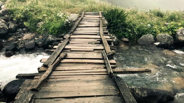 Fast moving river and wooden bridge in elevit plateau from rize turkey
